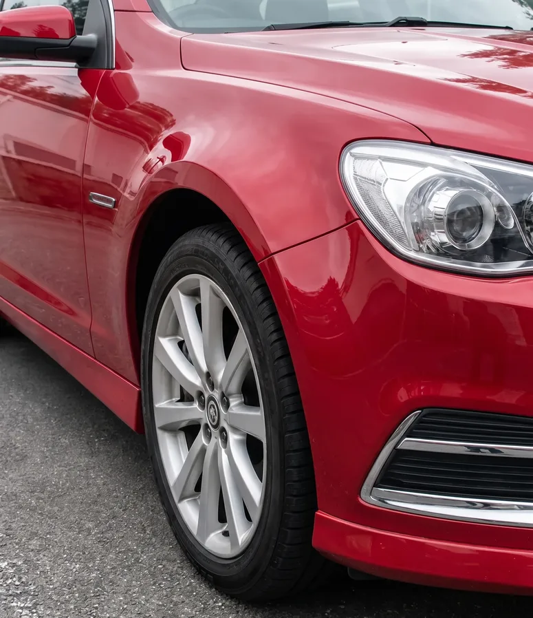 The same red front guard colour-matched and polished back to a factory finish