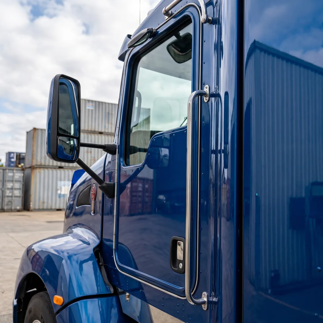 A blue truck cab door after a mobile paint repair