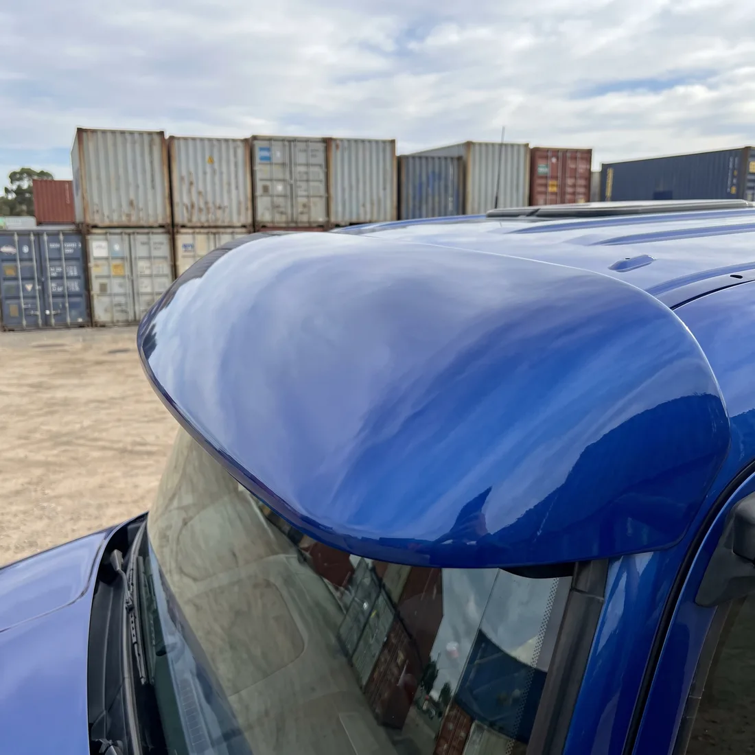 A blue truck sun visor resprayed and colour-matched to the cab